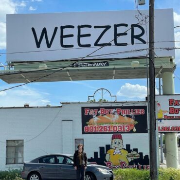 weezer-respond-to-prank-utah-billboard-with-one-of-their-own