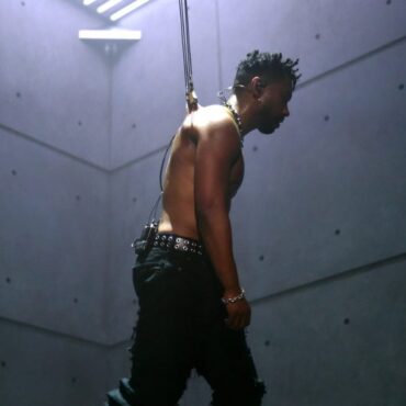 miguel-performs-while-suspended-from-hooks-in-his-skin