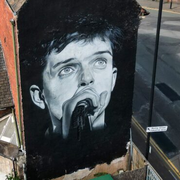 joy-division-mural-that-was-scrubbed-for-aitch-album-ad-finally-repainted-in-manchester