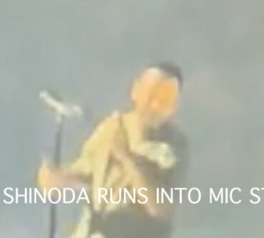 linkin-park-singer-runs-into-mic-stand-in-video